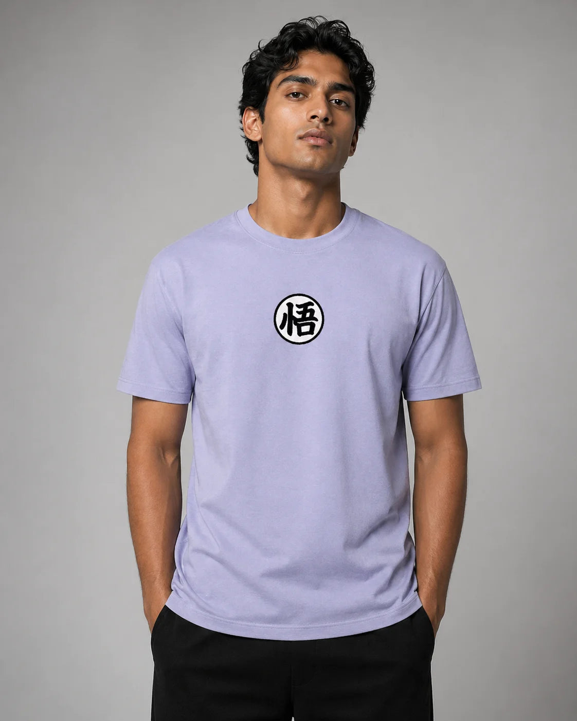 Man wearing a light purple t-shirt with a black and white symbol on a gray background