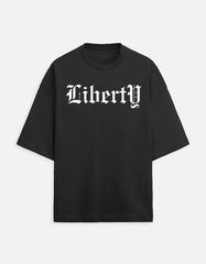 Front view of Noir - Hedes Liberty oversized black tee featuring a mythic Zeus and lightning graphic with Old English typography.
